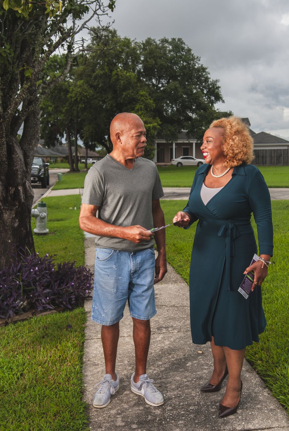 Candace N. Newell talking with a neighbor while canvassing